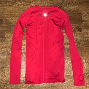 A red lululemon long sleeve shirt